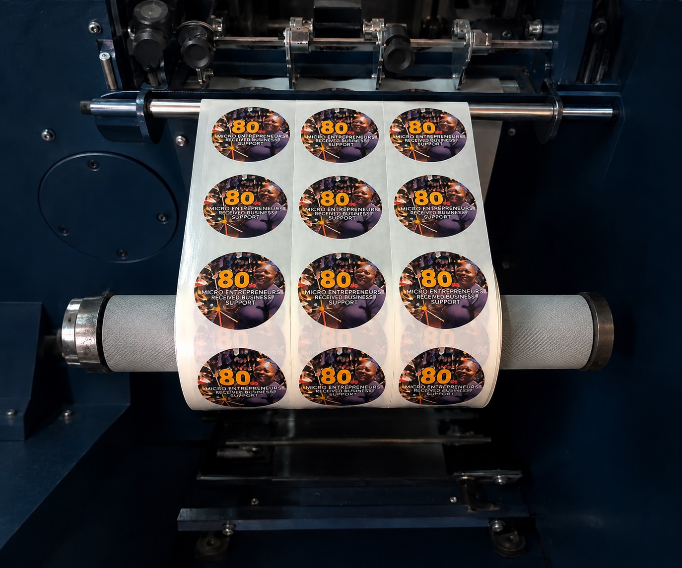Roll of custom full-colour labels being produced by Dynamic Signs & Print