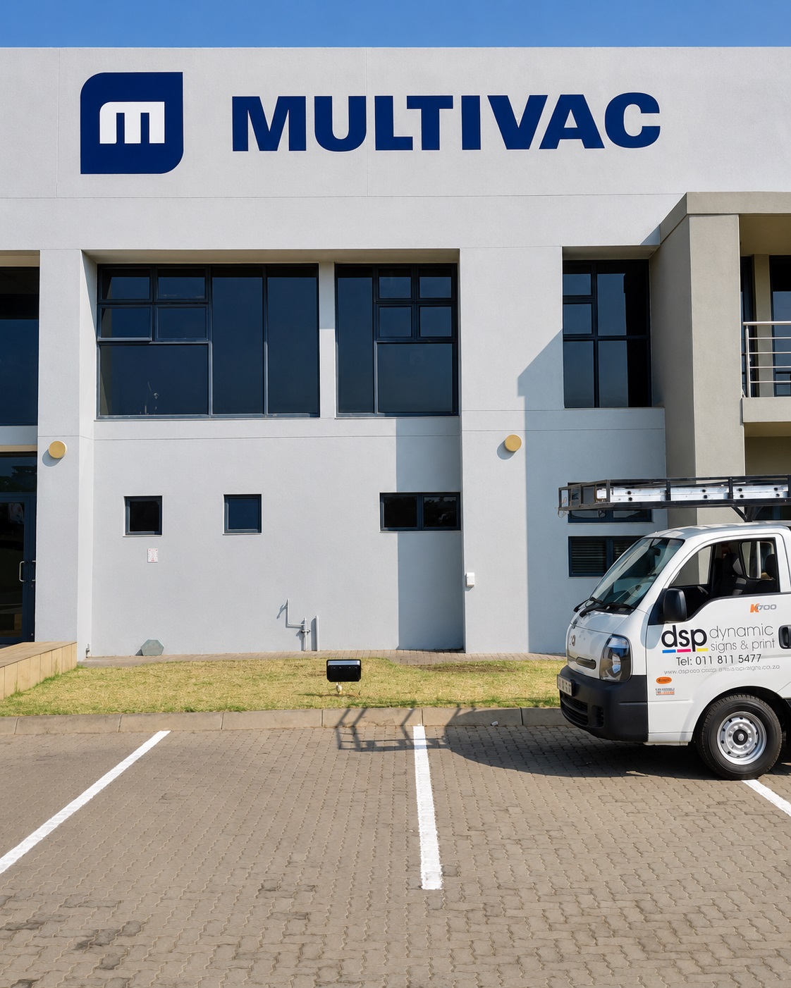 Completed Multivac building signage with a Dynamic Signs & Print installation vehicle in Gauteng.